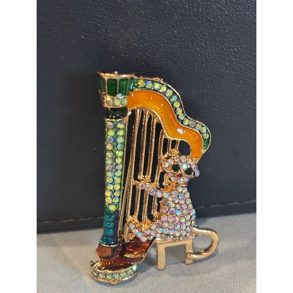 #3.  Gold-tone Harp Cat Brooch